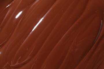 Tasty melted chocolate as background, top view