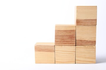 Many blank wooden cubes on white background