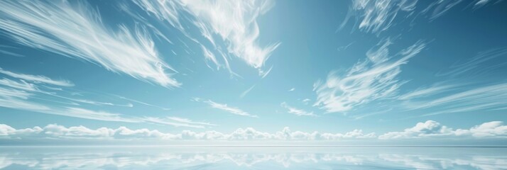 A wide-angle photograph of a vast, clear blue sky with wispy clouds. The image has a clean, minimalist feel, ideal for adding text or graphics