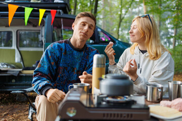 Adventure Time: Couple and Minivan Pausing for Marshmallow Snacks