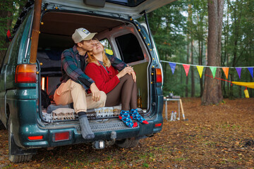 Couple Unwinding Inside Van in Quiet Forest Environment