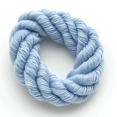 A soft blue color of thick rope, with the texture of yarn, is coiled in an irregular circle on white background. The rope appears to be made from fine threads and has no wrinkles or folds,