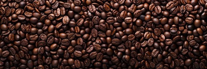 Fototapeta premium Overhead view of backdrop representing halves of dark brown coffee beans with pleasant scent 