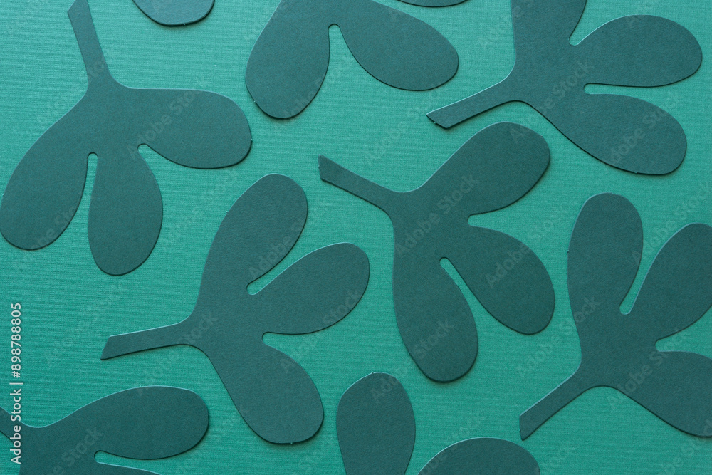 Sticker die-cut dark green paper leaves on green paper