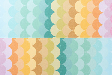 retro-style scrapbooking paper with scalloped pattern in yellow and green