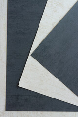 Fototapeta premium dark charcoal gray and texture beige scrapbooking paper sheets overlapping