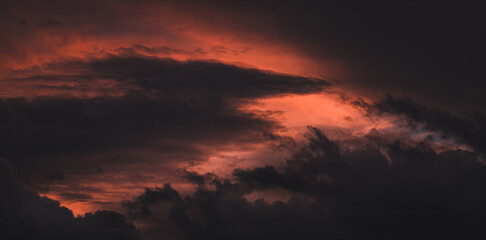 Dramatic sunset sky background. Vivid orange clouds.
