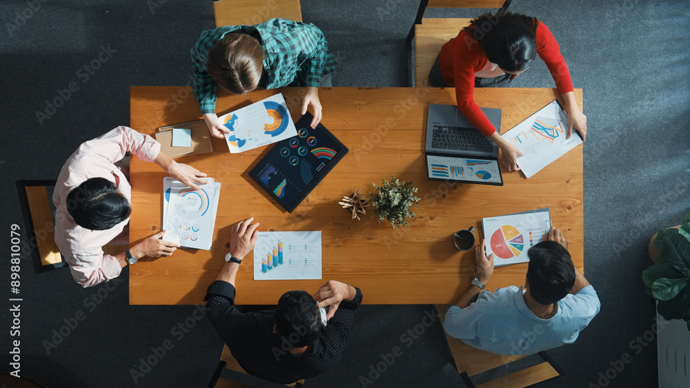 Aufkleber top down view of manager holds tablet display increasing sales and placed on meeting table. group of