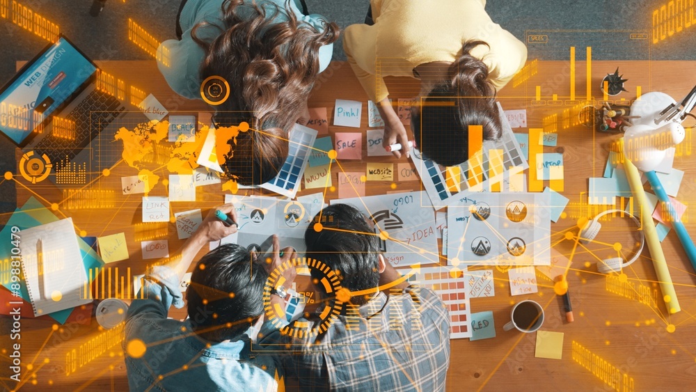 Aufkleber top down view of business team with casual outfit looking laptop screen and sharing idea. aerial vie