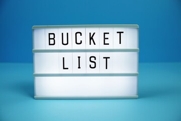 Bucket List letterboard text on LED Lightbox on blue background