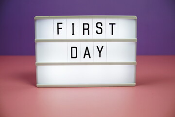 First Day letterboard text on LED Lightbox on pink and purple background