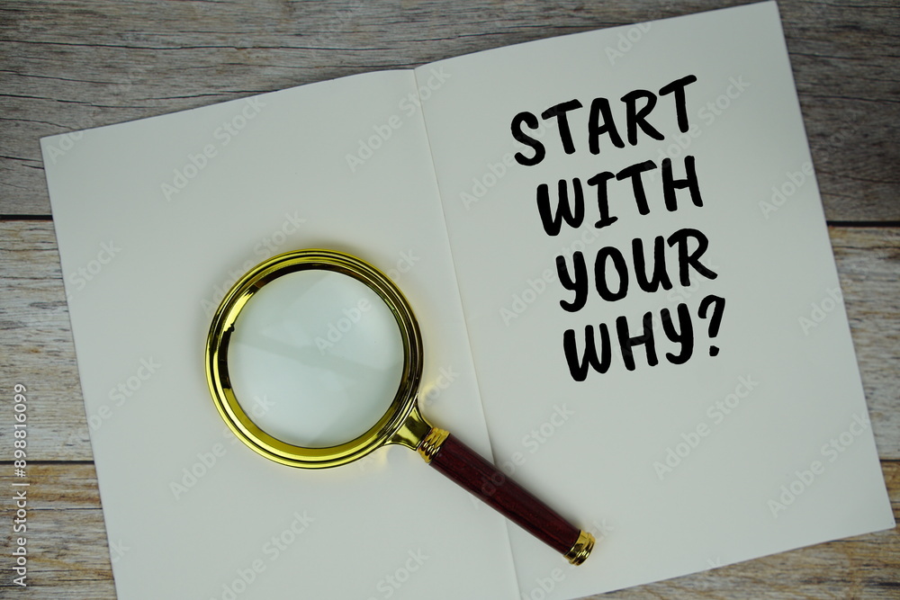 Poster start with your why? text on notebook page with magnifying glass top view on wooden background