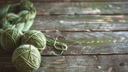 Balls of green yarn on aged wooden table
