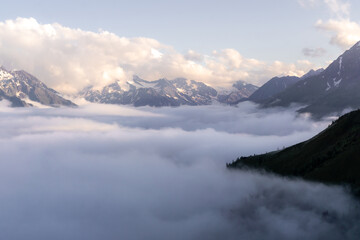 mountain landscape with clouds in the evening