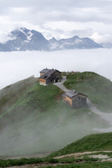 alpine hut on a mountain above the clouds