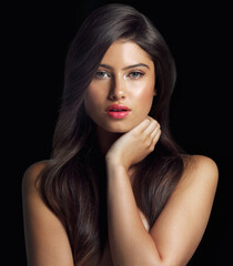 Fototapeta premium Woman, portrait and hair or hand for beauty in studio or makeup and cosmetic treatment for glow. Model girl, shampoo and wellness or growth with foundation, lipstick and aesthetic by black background