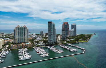 Naklejka premium Miami Beach scene from drone, Florida, USA. Miami seaside. Aerial view of Miami Beach and cityscape. Coastline of Miami Beach, aerial view. Famous American landmarks.