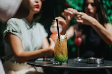 Multicultural businesspeople enjoying drinks and celebrating success at an outdoor gathering. Happy social interaction in a relaxed atmosphere.