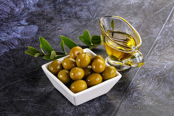 Ripe tasty green olives with branch