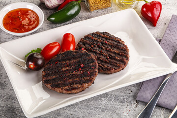 Grilled burger cutlet with sauce