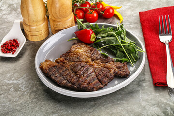 Grilled chuck roll steak with arugula