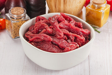 Raw beef meat - sliced strips