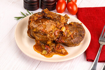 Italian cuisine - ossobuco with sauce