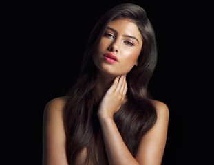Fototapeta premium Woman, portrait and makeup or hand for hair in studio for salon and beauty treatment for glow. Model girl, shampoo and cosmetics or growth with foundation, lipstick and aesthetic by black background