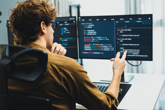 Working IT developer with stressful overworked in creating online software development coding on pc screen, thinking program for latest version application on website project at modern office. Gusher.