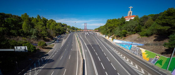 Access road to the bridge and tolls on the 25 de Abril bridge seen from the city of Almada without any vehicle, without car traffic.Almada-Portugal