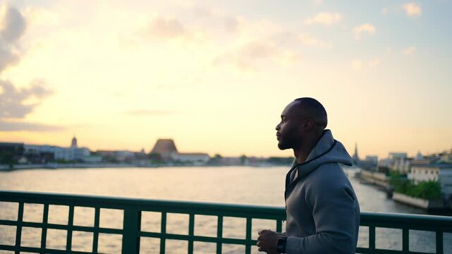 4K African man in sportswear jogging exercise on city street. Healthy guy athlete enjoy outdoor active lifestyle sport training running fitness workout in the city. Health care motivation concept.