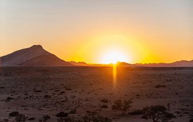 Impression of the Sunrise in the Namibian Desert near cha-re.