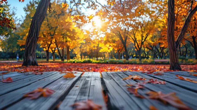 Empty wood table top and blurred autumn tree and red leaf background - can used for display or montage your products