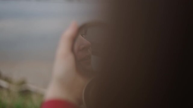 The model putting on her makeup through the mirror