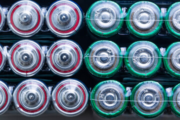 Macro battery,Several batteries are next to each other,Close up of positive ends of discharged batteries of different sizes and formats, selective focus
