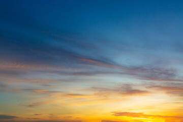 Beautiful Vivid sky painted by the sun leaving bright golden shades.Dense clouds in twilight sky in winter evening.Image of cloud sky on evening time.Evening Vivid sky with clouds