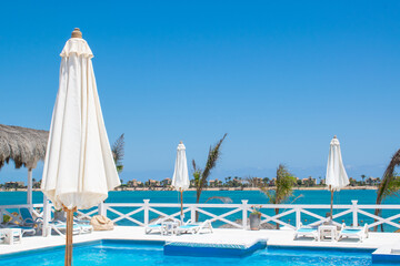 pool at the beach resort Summer vacation with copy space blue sky