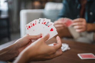 Close up of women hand hold and play card