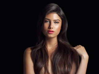 Obraz premium Woman, portrait and makeup or hair care in studio for glow and beauty or salon treatment. Model girl, shampoo or cosmetics for growth and foundation or lipstick for aesthetic by black background