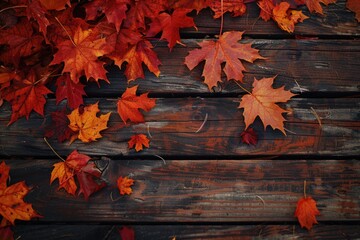 Obraz premium Close-up of autumn leaves on a wooden surface, perfect for decorating or design inspiration
