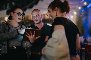 Diverse group of young professionals having a night business meeting, engaging in discussions and sharing ideas in a modern and vibrant setting.