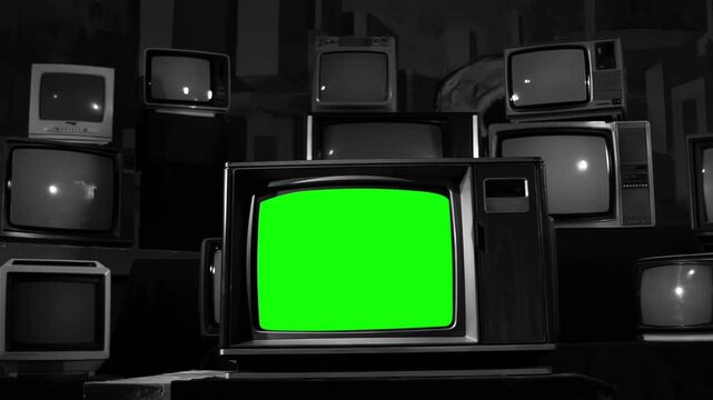 Vintage TV with Green Screen Surrounded by Multiple TVs &ndash; 80s Aesthetic, Black and White Tone, Dolly In Movement. 4K Resolution.