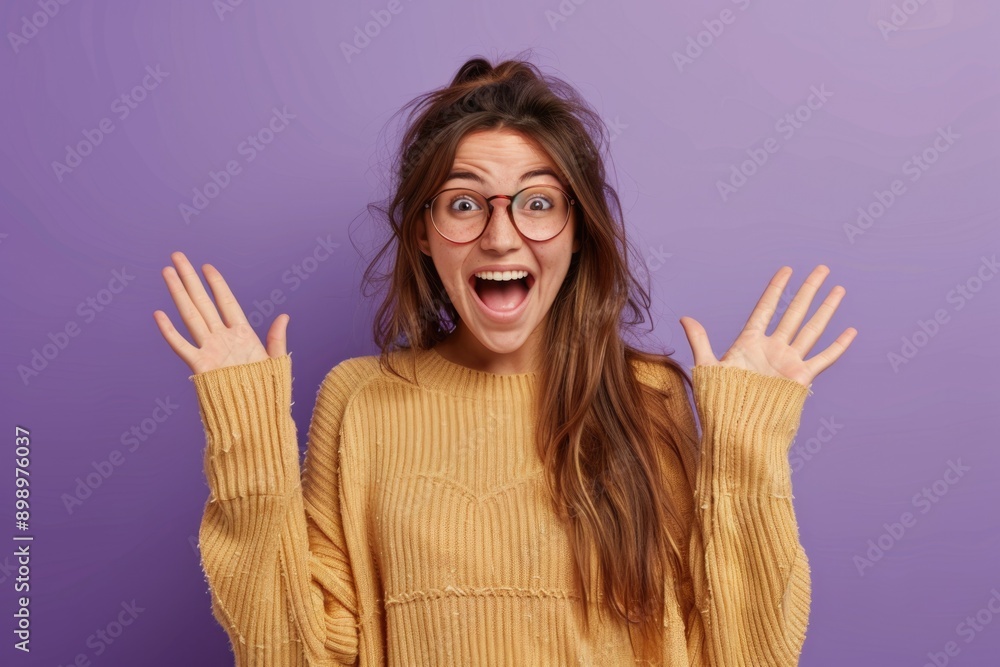 Canvas Prints a woman wearing a sweater and glasses makes a comical expression