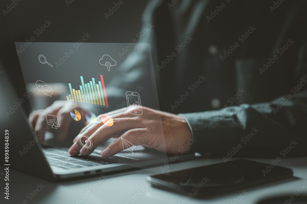 Fototapete Person typing on a laptop with various data charts and icons. It symbolizes the use of digital technology for data analysis, communication, and cloud computing in a modern work environment.