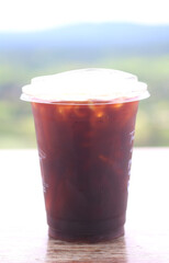 Iced black coffee (Americano) on wood table