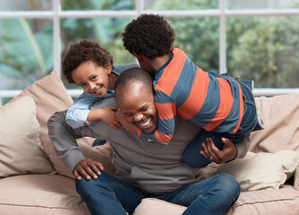 Black family, father and children with laugh on sofa with climbing, games and playful for...