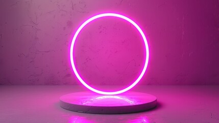 Obraz premium A vibrant pink neon light circle glowing against a textured background, creating a modern and artistic ambiance.