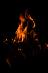 Fototapeta premium Fire flames on black background. Fire flame texture. Fire flame with copy space. Flames textured background. Flames on black background.