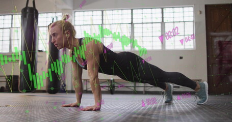 Performing push-ups, woman exercising over financial data processing image