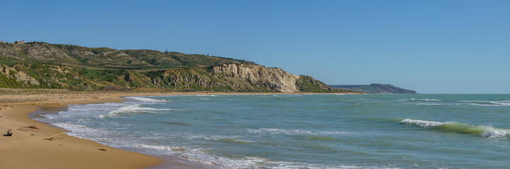 Panoramic view of beach at nature reserve of Torre Salsa on a sunny day, Sicily, Italy